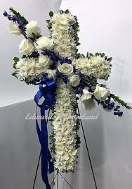 Show your sympathy with a gift of flowers. Blue And White Hanging Cross Sympathy In Fort Morgan Co Edwards Flowerland