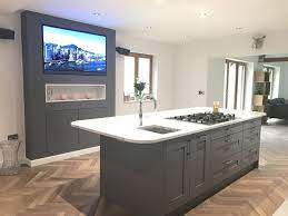 Kitchen is an important part of house that must be situated at its ideal place because wrong position of fire can disturb family members in most critical way. Kitchen Island With Feature Entertainment Backdrop Central Hob And Prep Sink And Quooker Kitchen Island With Sink Kitchen Island Hob Kitchen Island With Hob