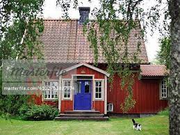 a red house with a blue door sweden stock photos red house house exterior red houses