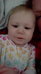 Mom Listening to Nora James with Her Baby