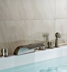 Change the faucets for the bathtub and shower. Juno Monora Triple Handle Waterfall Roman Tub Faucet With Hand Shower