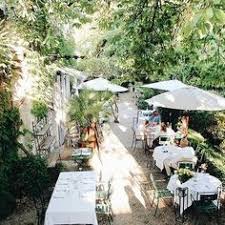 Le Jardin Du Quai L Isle Sur La Sorgue L Isle Sur La Sorgue Is A Quiet Riverside Town Known Primarily For Its Sunday An In 2020 South Of France Outdoor France Travel