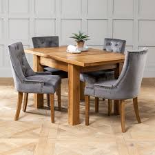 Dimensions are 44 1/2 across and 29 high. Solid Oak Small Extending Table 4 X Storm Grey Scoop Chairs The Furniture Market