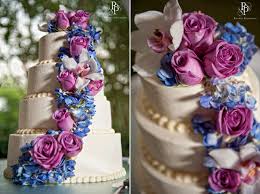 Check spelling or type a new query. Ivory Four Tier Stacked Wedding Cake Adorned With Fuchsia Roses And Purple Blue Hydrangeas