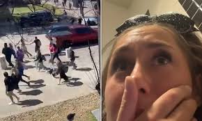 Heart-stopping moment cheerleaders are forced off stage as 'gunfire' leads  to stampede at Texas competition