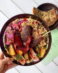 Lamb kofta and couscous salad. Blackwood Pantry Long Weekend Special Lamb Kofta With Tahini Yoghurt Base And Israeli Couscous Salad Crispy Beetroot Chips Pickled Purple Cauliflower Heirloom Tomatoes Dressed In Balsamic Served With Grilled Zaatar Pita
