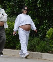 Vanessa Hudgens growing baby bump on display as pregnant star wears white  crop top and sweats during walk in LA | The US Sun