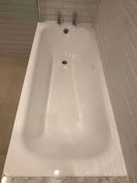 The enamel looks at first glance as if covered in lime scale, however no amount of cleaning seems to get it off, and along centre line at bottom of bath there seems to be clear of lime scale but pitted. Cast Iron Bath Re Enamelling Bath Repair London Essex Hertfordshire