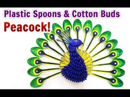 Diy Room Decor How To Make A Peacock From Plastic Spoon There Is An Altogether Different Feel And Charm Of In 2021 Peacock Crafts Plastic Spoon Crafts Spoon Craft