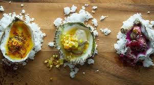 Oysters Saffron Pickled Cucumbers Aleppo Recipe Tasting Table Recipe Herb Oil Recipe Condiment Recipes Recipes