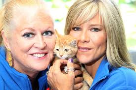 Sam Fox and Kim Woodburn with a kitten