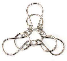 This one is 2 horshoe shaped rings with a connector in the center. Classic 3 Rings Horseshoe Metal Iron Wire Puzzle Brain Teaser Puzzles Game For Children Adults Puzzle Games With Pictures Game Jigsaw Puzzlegame Meat Aliexpress