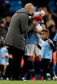 Manchester city starlet phil foden becomes a father for the first time at the age of just 18 foden and girlfriend rebecca cooke are believed to have welcomed a baby boy premier league footballer is said to be supporting his girlfriend and their child Phil Foden S Baby Son Gets Kiss From Pep Guardiola As Man City Edge Closer To Title Mirror Online