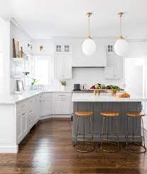 White backsplash with gray kitchen cabinets. Light Gray Kitchen Cabinets With Dark Gray Island Transitional Kitchen