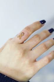 The hand is a woman's second face. Finger Tattoos Simple Yet Unique Designs At Your Fingertips Glaminati Yellow Ribbon Tattoos Finger Tattoos Cancer Ribbon Tattoos