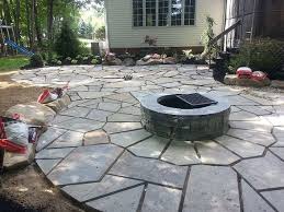 Shown in bluestone blend with optional barbeque & fire pit spark screen Marshy Mess Turned Usable Living Space Stark County Landscaping