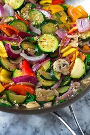This easy, healthy, and vibrant green, recipe for sauteed spring vegetables calls for asparagus, artichokes, and ramps. Hummus And Sauteed Vegetable Flatbread Wraps Recipe Little Spice Jar Recipe Flatbread Wrap Recipes Healthy Recipes Sauteed Vegetables