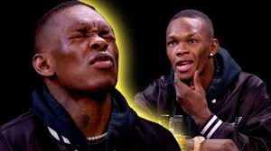 Israel Adesanya talks NZ, family and UFC while sweating through 'Hot Ones'  interview