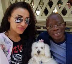 Photo of Adams Oshiomhole, his wife Lara and their dog