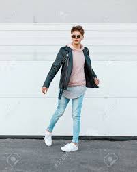 Young Guy In A Stylish Black Leather Jacket A Pink Sweatshirt Stock Photo Picture And Royalty Free Image Image 82165108