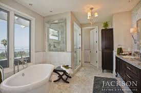 Tuscan bathroom design employs warm color palettes and a rich use of traditional metals to distinguish it from similar styles of design. Old World Luxury Jackson Design Remodeling