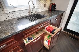 Once you've wiped down your cabinets, simply wipe them dry for that shiny look you love. 11 Smart Kitchen Storage Solutions Multi Trade Building Services