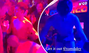 Tom Daley has his PANTS pulled off by an overexcited fan while  crowd-surfing in France | Daily Mail Online