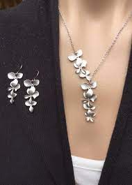 Silver Orchid Cascade Necklace And Triple Orchid Earring Set Etsy Cascade Necklace Orchid Earrings Earring Set