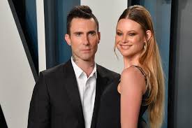 Adam levine and behati prinsloo welcomed daughter dusty rose on wednesday, and just two days later the proud parents showed off their precious on saturday night adam levine and pregnant wife behati prinsloo went to dinner at restaurant craig's in hollywood, and she's due to give birth in less. Adam Levine Dons A Dress Matches Wife And Daughters For Family Photo