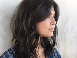 Rich bangs cut with choppy ends mimic natural looking brunette roots and bronde color like on this ombre 'do. Curtain Bangs Are The Most Flattering For Every Hair Type Glamour