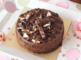 Indulgent chocolate sponge cake covered in ganache frosting with chocolate decorations, topped with galaxy ripple® and drizzled in chocolate. Celebrating Everyday With Galaxy Katie Kirk Loves