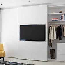 Meanwhile, you can put your shoe and clutch bag collections in the wall cabinet on the opposite side. Tv In Closet Design Ideas