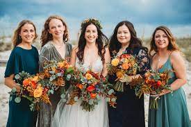 Candle lanterns hanging will give an intimate and cozy touch to the ceremony, and you can also put flowers or succulents in them. October Beach Wedding Jubilee Flowers Fairhope