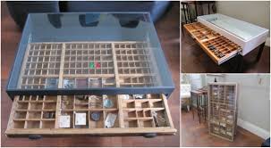 The original metal tray handles are attached and the table rises on four splayed turned wood legs. The Many Uses Of An Ottoman Coffee Table Coffee Tables For Homes Printers Tray Display Coffee Table Handmade Table