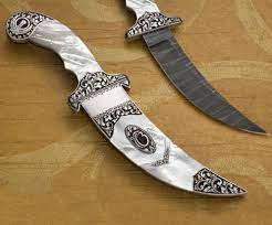 It is an article of faith that initated sikhs are supposed to wear at all times. Engraved Stylized Mother Of Pearl Kirpan Khalsa Raj