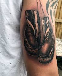This is a decent quality in a person, and the boxing gloves tattoo is a great way to represent this thought. 40 Boxing Tattoos For Men A Gloved Punch Of Manly Ideas