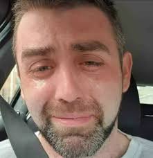 This is the last photo of 34-year-old Phillip Herron, crying in his car  just minutes before taking his life. A single father of three, he was  overwhelmed with over $20,000 in debt