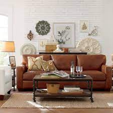 Animal prints liven up a room with brown leather furniture. 15 Dark Brown Leather Sofa Decorating Ideas