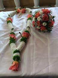Flowers can be used to compliment the bride and grooms outfits. Garlands Bouquets Leicester