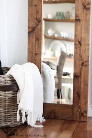 Mirrors are known for making a space seem larger and more open, but mirrors can also be used to distribute light, emphasize colors or artwork on adjacent walls, and enliven rooms that do not have windows. Diy Wood Framed Mirror The Wood Grain Cottage
