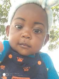 The girl ---- the yellow dress wearing/wear