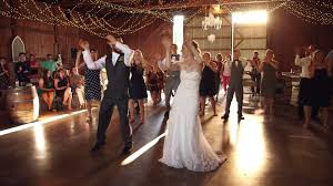 This Family Unveiled A Happy Surprise For Their Wedding Guests Wedding Dance Video Wedding Dance Surprise Dance