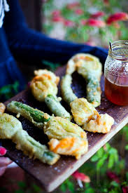 Heat half the clarified butter in a large frying pan over a very high heat and saute the zucchini until it is golden but still and holding its shape. Deep Fried Courgette Flowers Stuffed With Goats Cheese And Lavender Honey Donal Skehan Eat Live Go