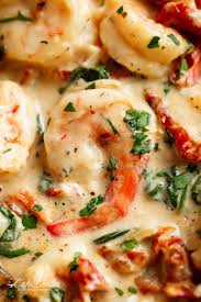 Add white wine, turn up heat to high. Creamy Garlic Butter Tuscan Shrimp Coated In A Light And Creamy Sauce Filled With Garlic Sun Dried Tomatoes And Spinach P Food Dishes Seafood Recipes Recipes