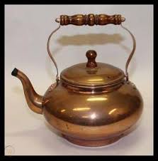 It has the look and feel of the past with its simple design. Old Fashioned Tea Kettle 413067567