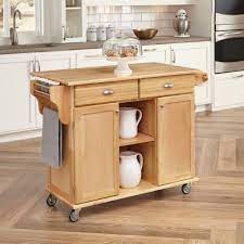 Kitchen islands with a white finish lend a crisp, casual look to kitchens, whereas dark finishes have a more formal appearance. Home Styles Natural Napa Kitchen Cart Walmart Com Walmart Com
