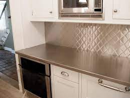 Metal tiles are welcome to create a cool backsplash! Stainless Steel Backsplash Quilt Texture Outdoor Kitchen Appliances Stainless Steel Backsplash Cabinets And Countertops