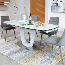 The contemporary styled quartz marble dining table is a beautiful contemporary design to suit the modern and fashionable interiors. Milano White Glass Ceramic Marble Effect 140cm Rotating Extending Dining Table 4 Chairs