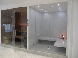 Basically, steam rooms aren't as hot as saunas, and they're much steam rooms have all the same health benefits as saunas, because the effects of heat are the same. This Stylish Steam Room Has White Corian Benches And Large Format Tiles To The Walls The Adjacent Sauna Is Ma Home Steam Room Steam Room Shower Home Spa Room
