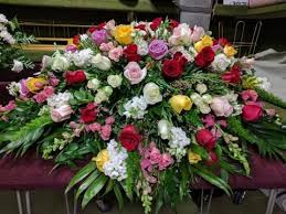 What kind of message is appropriate to send with funeral or sympathy some families may request a particular theme for funeral flowers for the service. Celebrate Life Full Casket Spray Casket Flowers Funeral Flowers Funeral Flower Arrangements